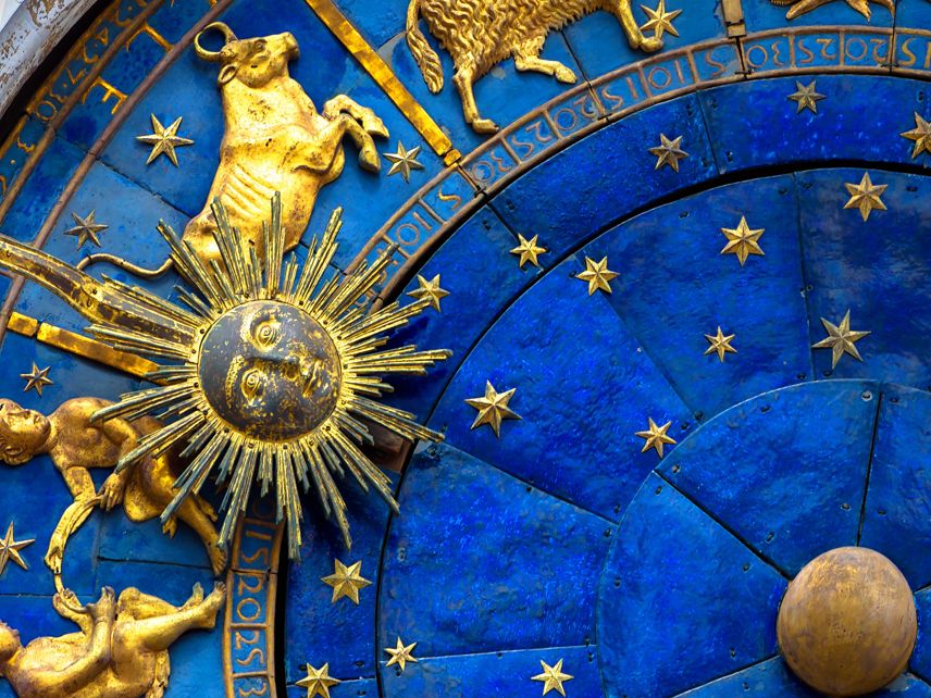 taurus sign zodiac on a gold and blue wheel